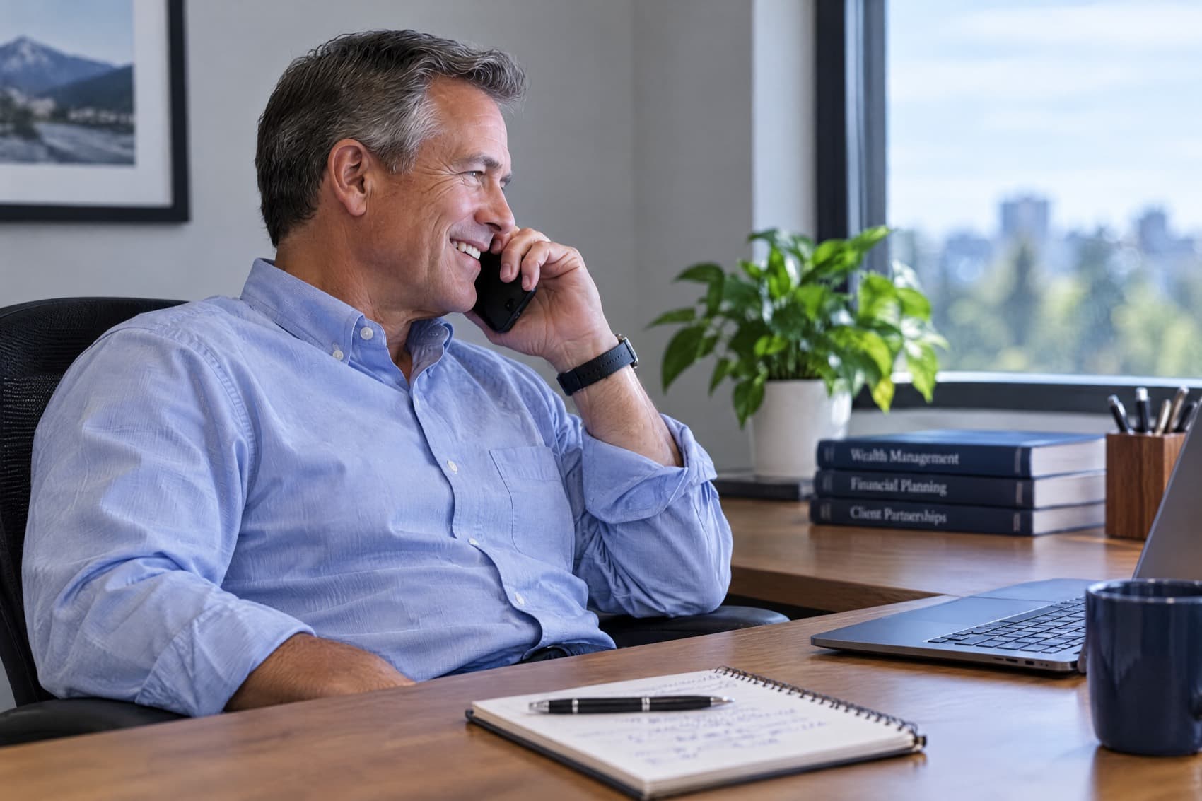 An advisor on the phone at his desk